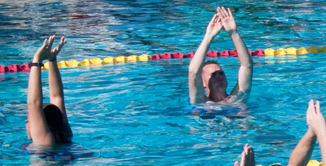 group of ladies in water doing fitness classes